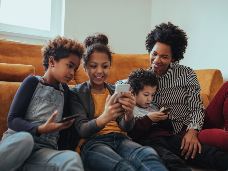 Portrait of a smiling mother enjoying time with her children